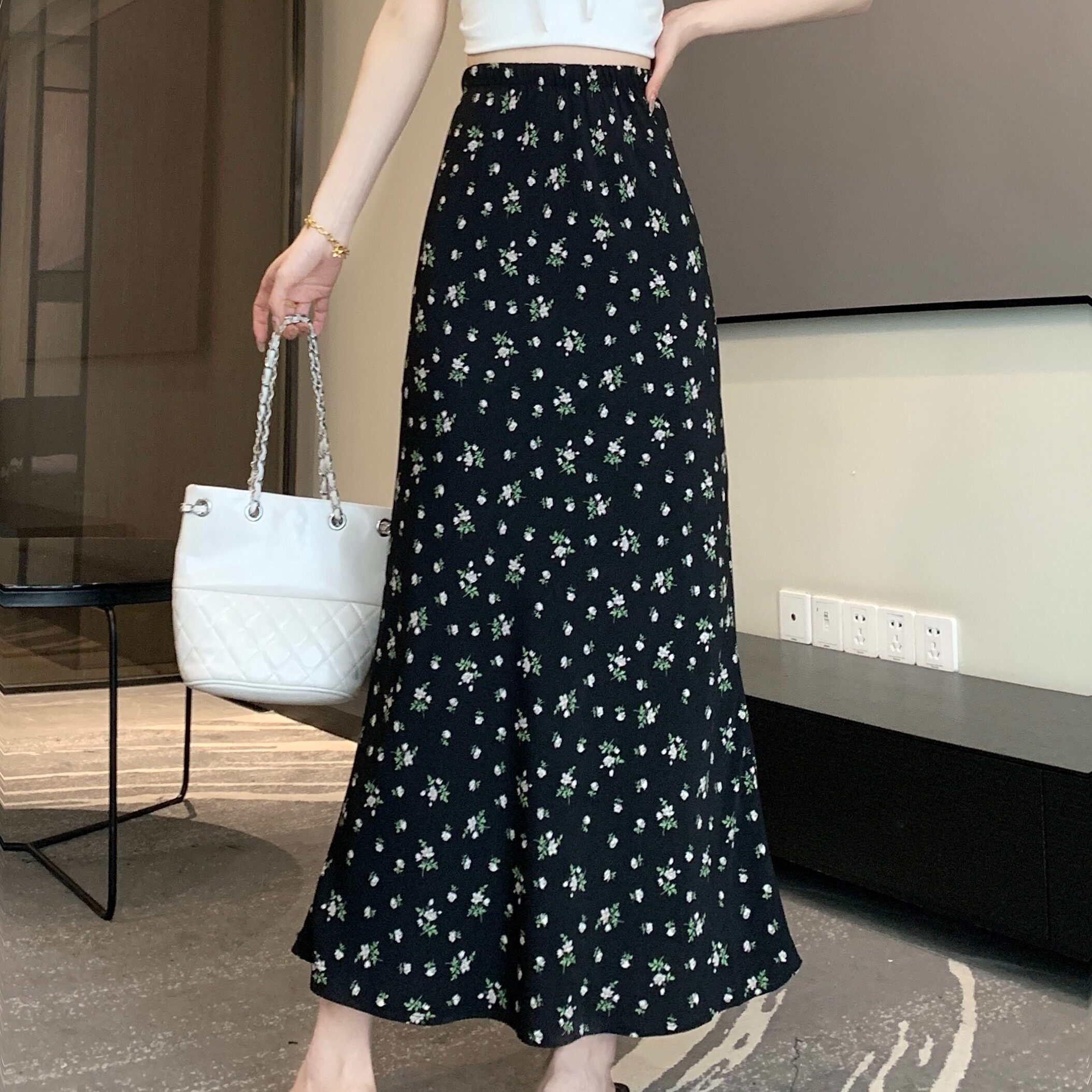 贝尔黑色碎花半身裙女夏季2026新款高腰修身显瘦a字中长裙子