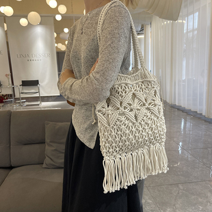 松弛感包包女2025新款 夏镂空编织腋下包海边度假草编包单肩水桶包