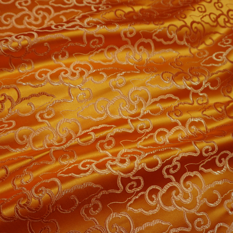 推荐桔色祥云纹丝绸古香织锦缎