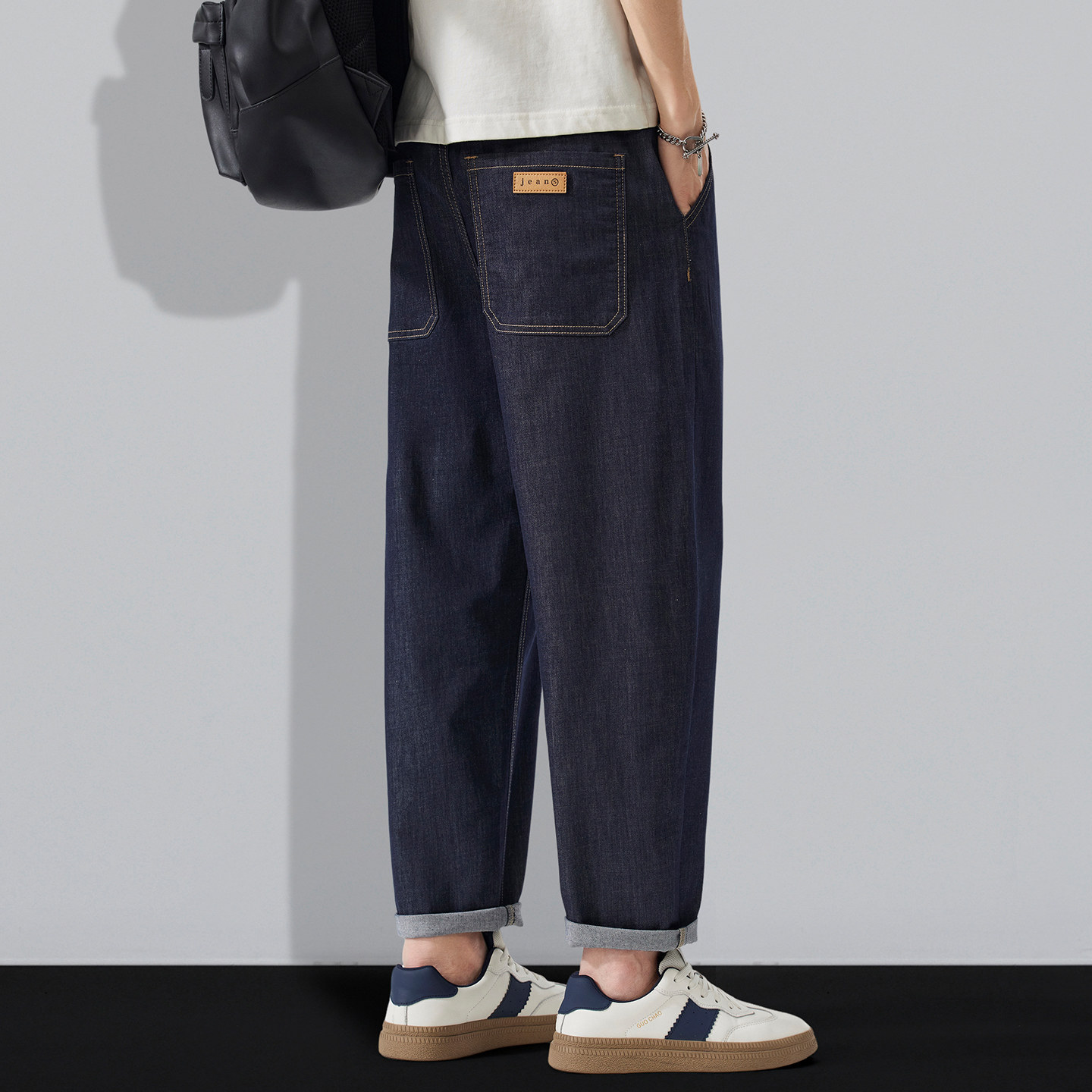 天丝亚麻防褪色面料新款男士凉感牛仔裤宽松弹力松紧腰锥形九分裤