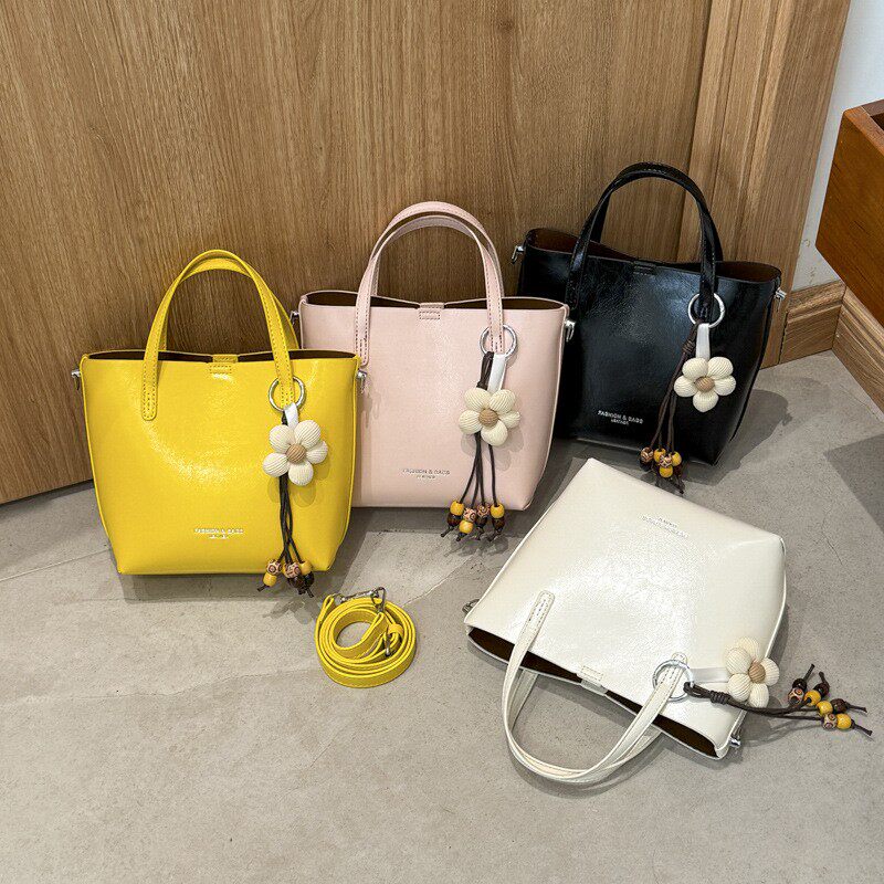 韩版小众手提水桶包女2026春季新款复古通勤单肩包日常休闲斜挎包