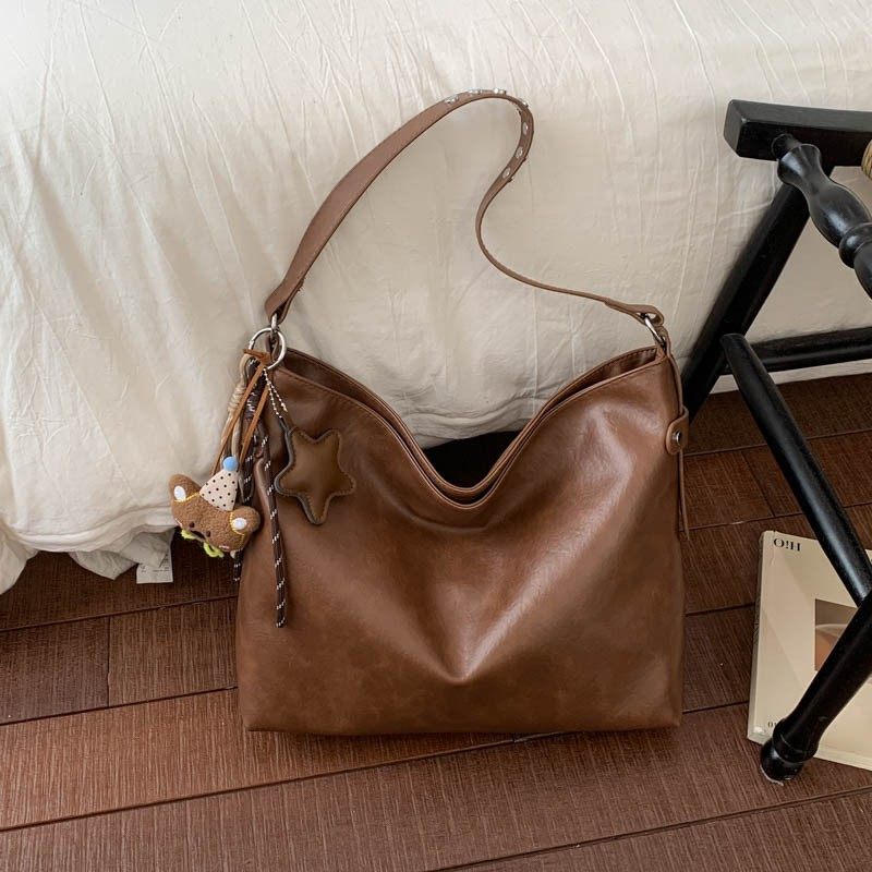 时尚简约大容量包包2026新款通勤女士单肩斜挎包大学生托特包