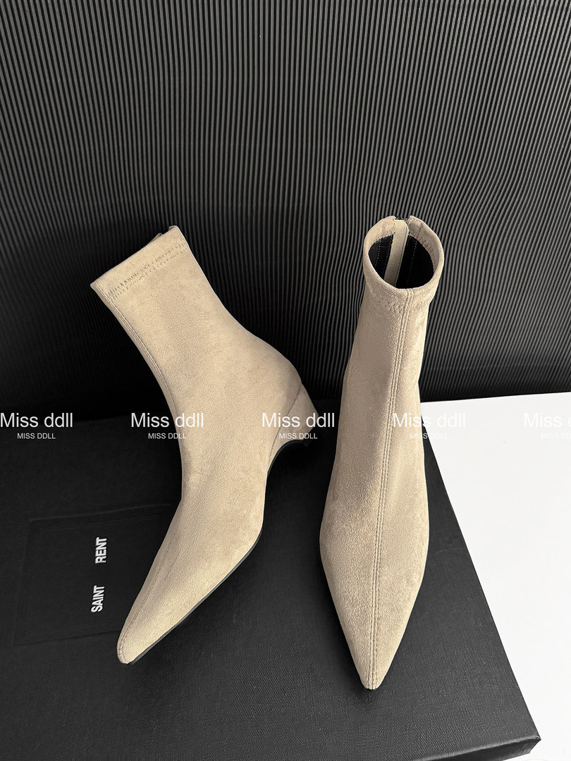 Beige suede pointed-toe ankle boots with stiletto heels