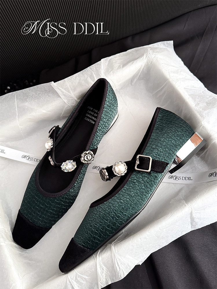 Pair of green textured embellished women’s flats with metallic heels