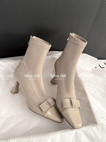 Beige suede ankle boots with pointed toes and block heels