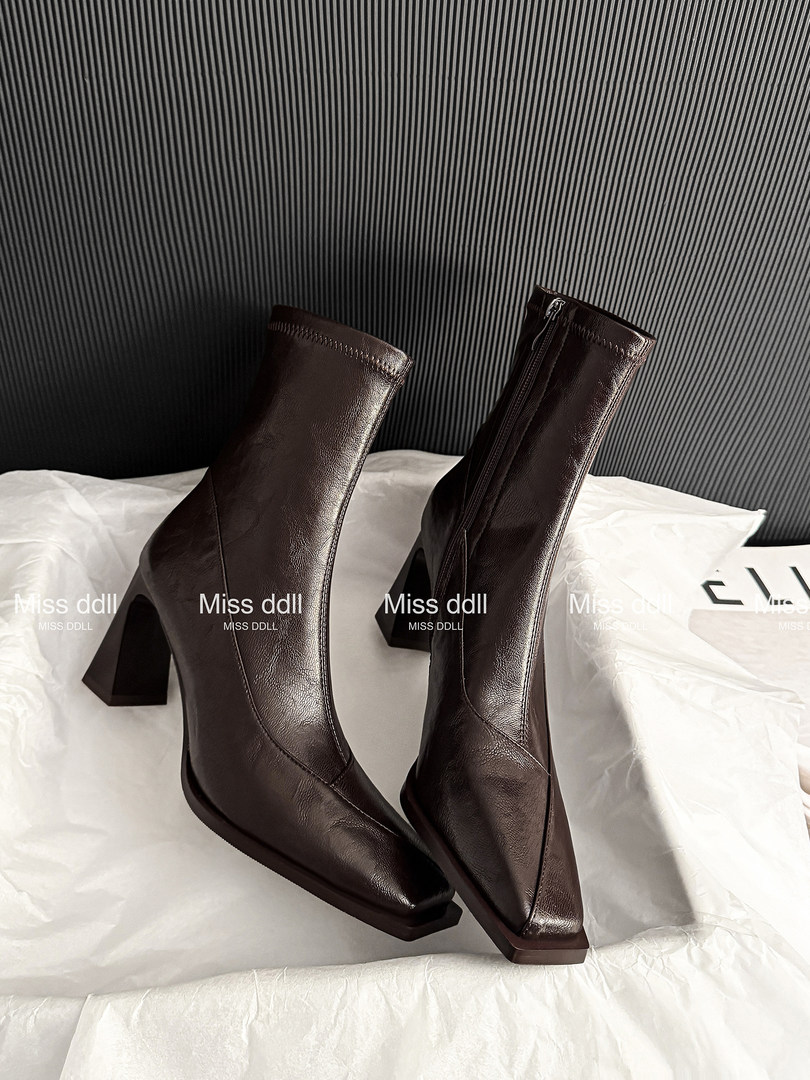 Pair of dark brown leather ankle boots with high block heels