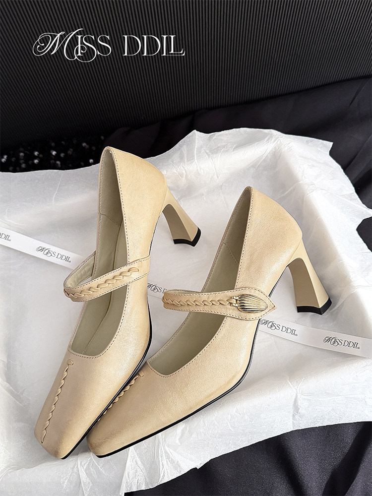 Beige pointed-toe high heel pumps with braided strap detail
