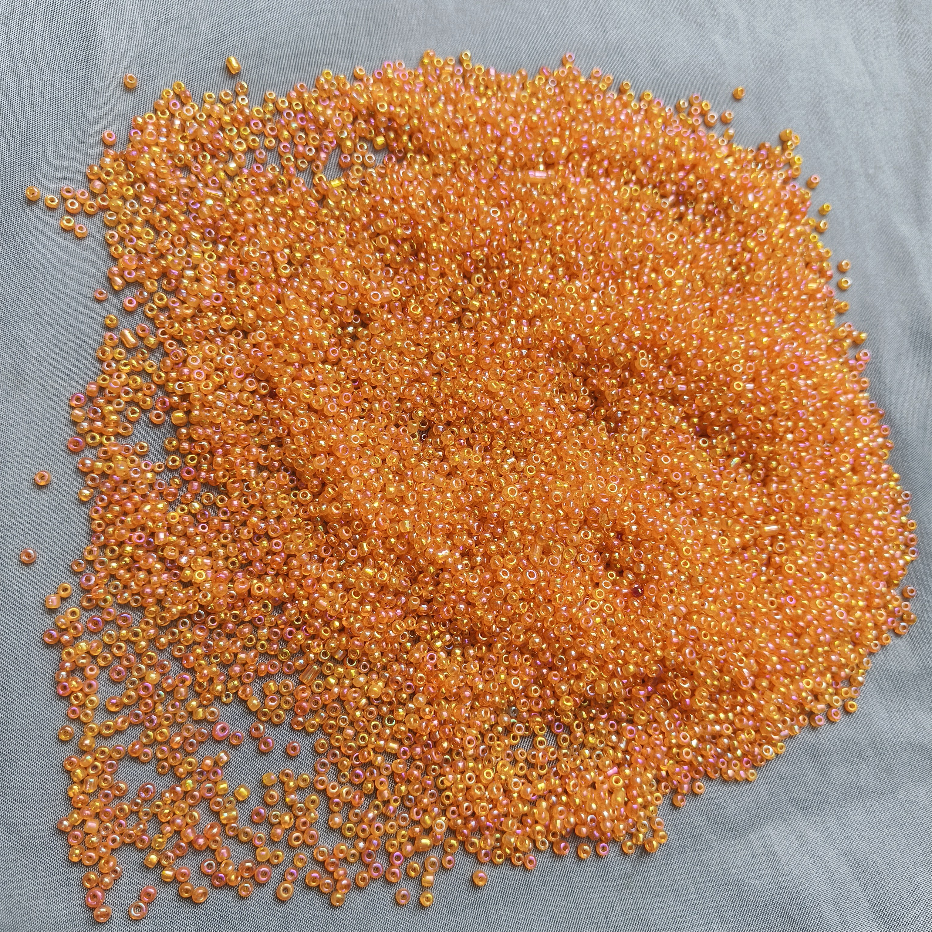 911 3-4mm半斤幻彩橘色米珠图片全部的量