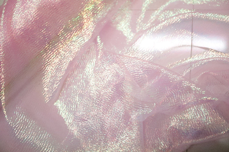 设计师面料日本进口璀璨荧光粉色透明柔软面料舞台装服装面料