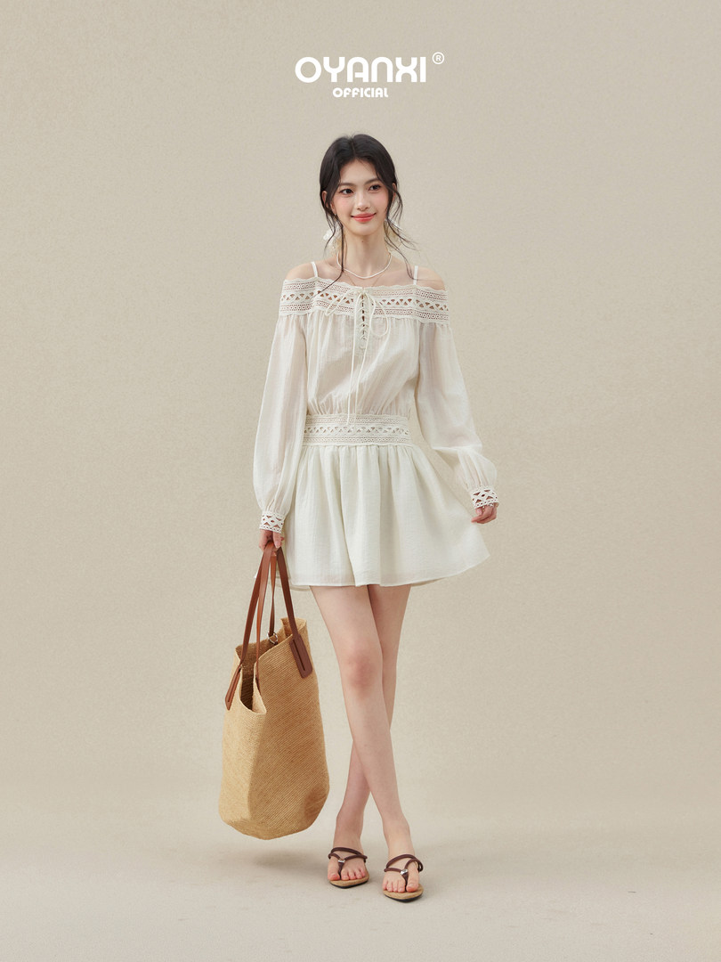 White off-shoulder lace-trim dress worn by a model