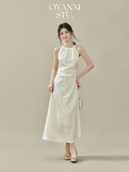 Model wearing a white sleeveless midi dress