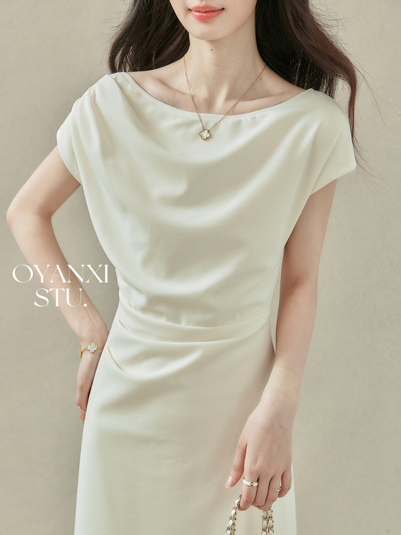 Cream elegant off-shoulder dress worn by a model