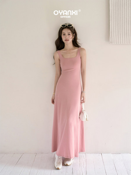 Model wearing a pink sleeveless maxi dress