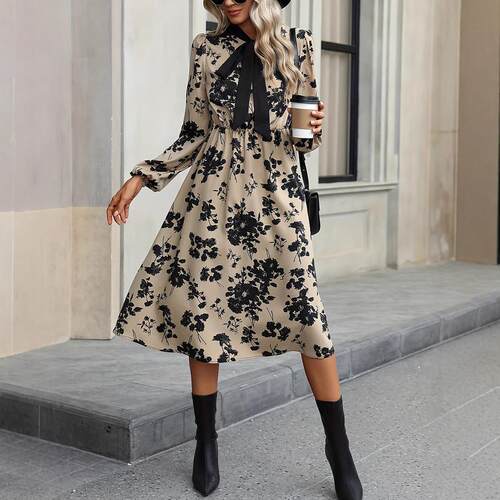 Floral dress with long sleeves, collar tied, medium to