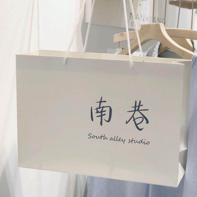服装店袋子定做女装店纸袋手提袋定制童装购物袋加厚