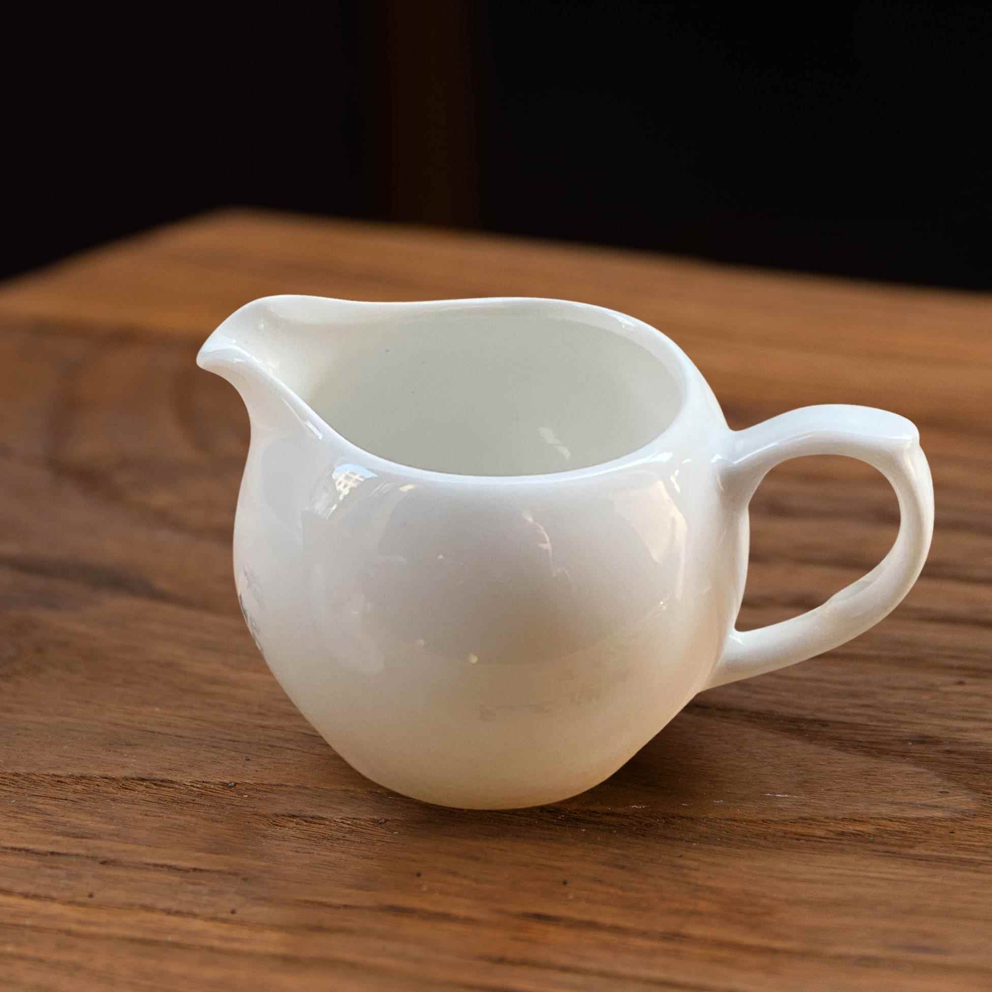 公道杯2026新款陶瓷羊脂玉茶具带把公道杯茶漏套装分茶器一体分茶图片