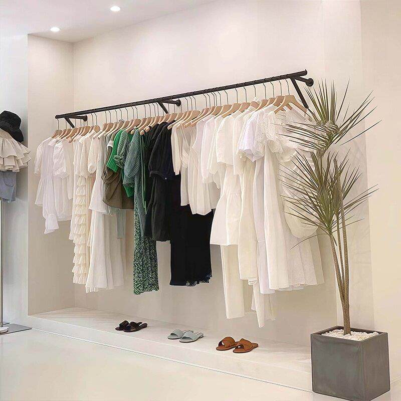 新款服装店上墙展示架黑色烤漆铁艺婚纱童装女装店货架陈列挂衣杆