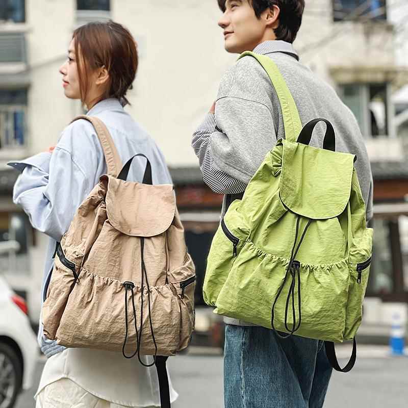 时尚双肩包实用大容量抽绳设计小众休闲轻便男女可背睿营面料背包