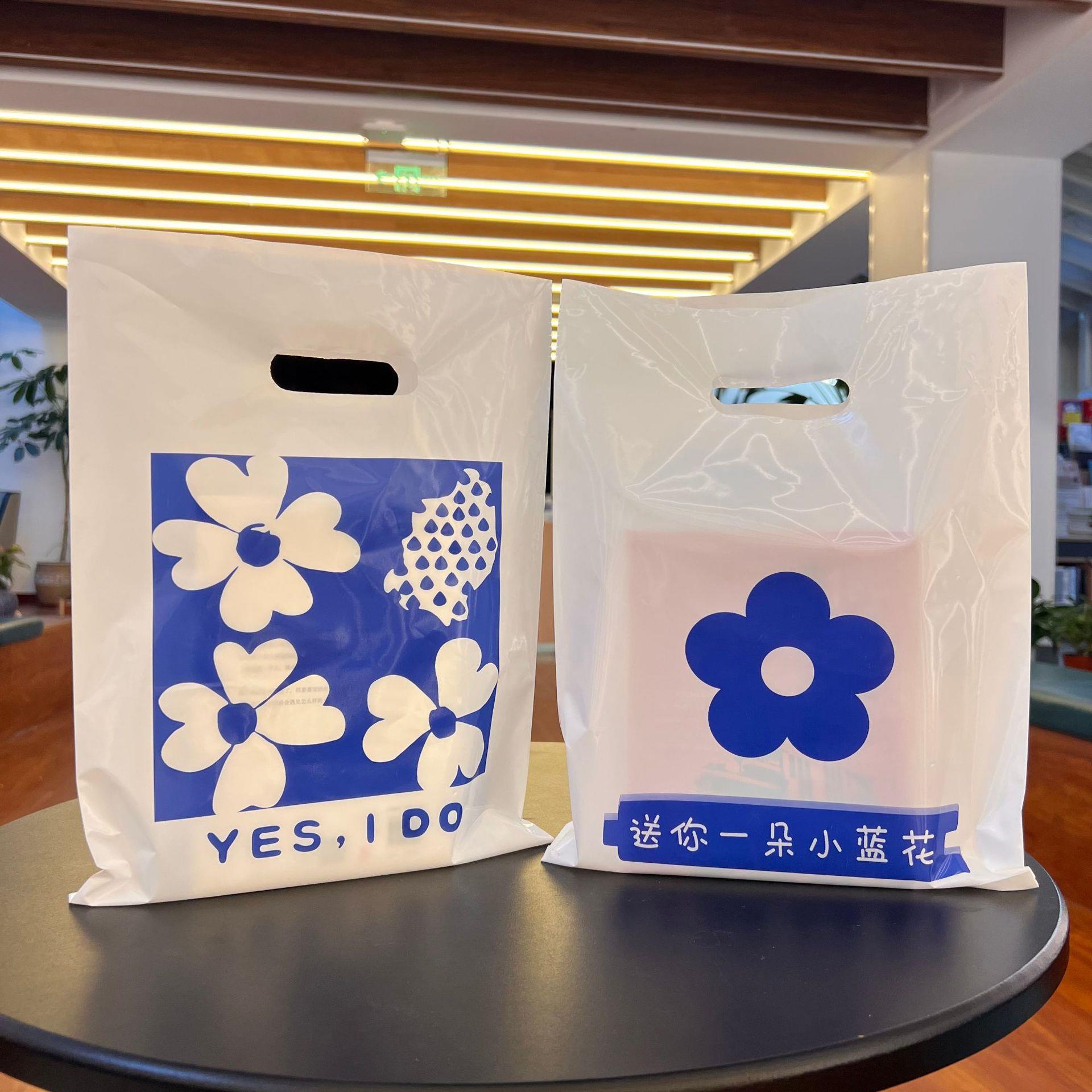 加厚扣手四指袋塑料小饰品礼品女装儿童服装店用手提袋子包装手拎