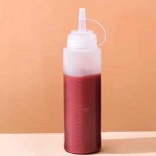 Squeezable sauce bottle with measurements for ketchup, salad