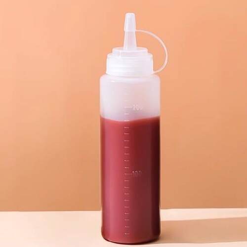 Squeezable sauce bottle with measurements for ketchup, salad