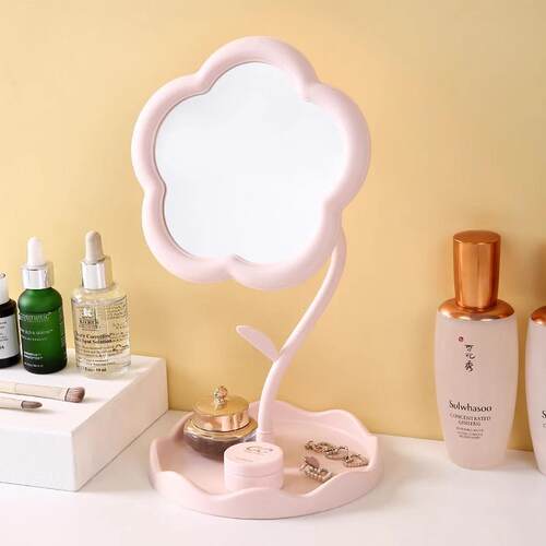 A desk-mounted jewelry and makeup mirror for a girl's vanity