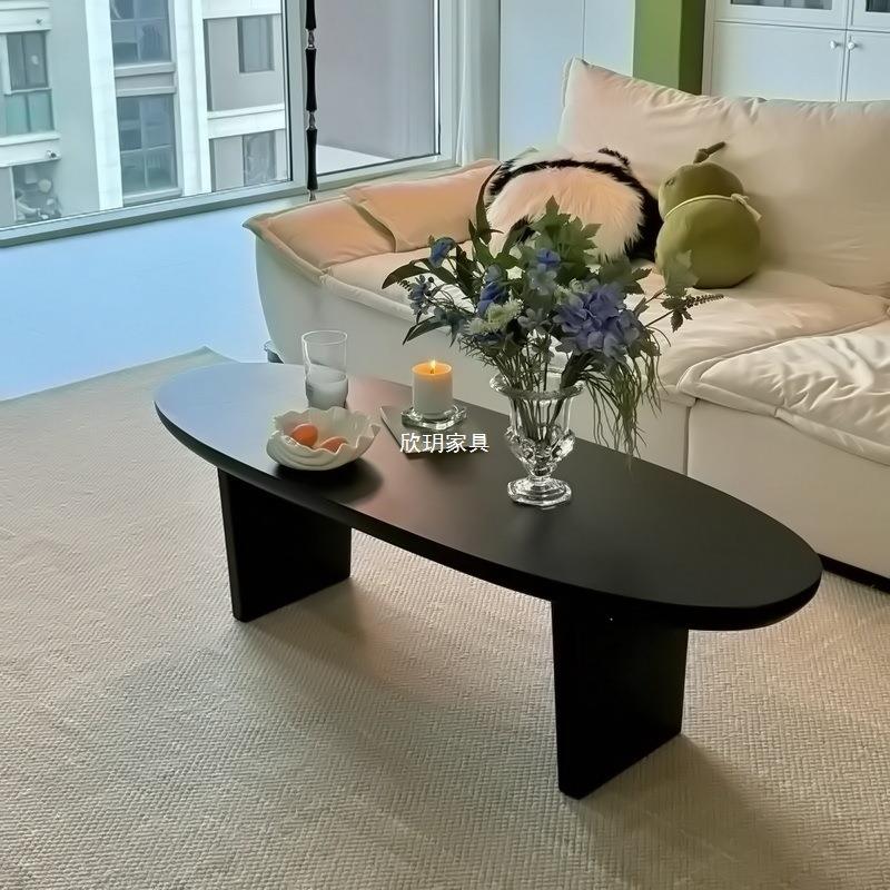 新公馆新中式黑色实木茶几椭圆形简约客厅家用小户型民宿原木桌子