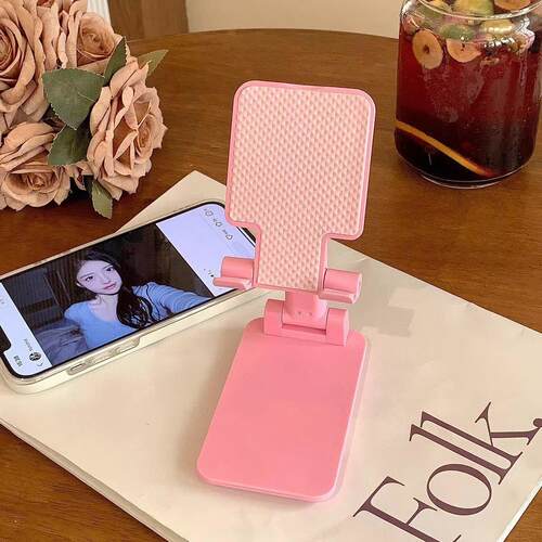 A versatile and durable desktop stand for mobile phones, fea