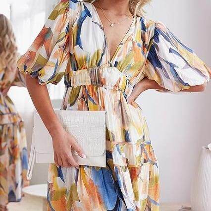 Women's floral mid length dress with pleats, flowing beach