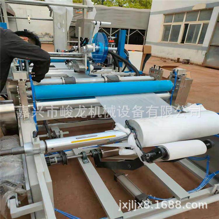 1全自动无纺布复合膜贴标不干胶手术洞巾铺单美容按摩床单折叠机