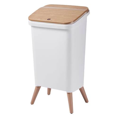 A slim, press-top, flip-lid trash bin with a luxurious yet u