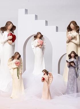 欧式软装桌面花仙子天使雕像爱心女神抱花看书玄关家居酒柜摆件