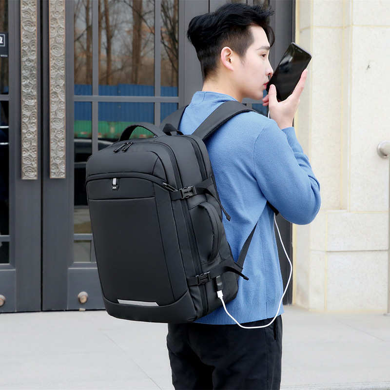 跨境手提两用电脑背包商务防水充电通勤反光大容量旅行男女双肩