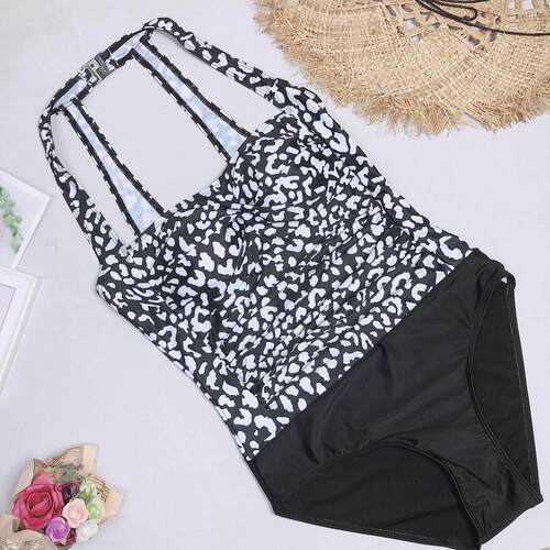 One-piece swimsuit with triangular bikini splicing