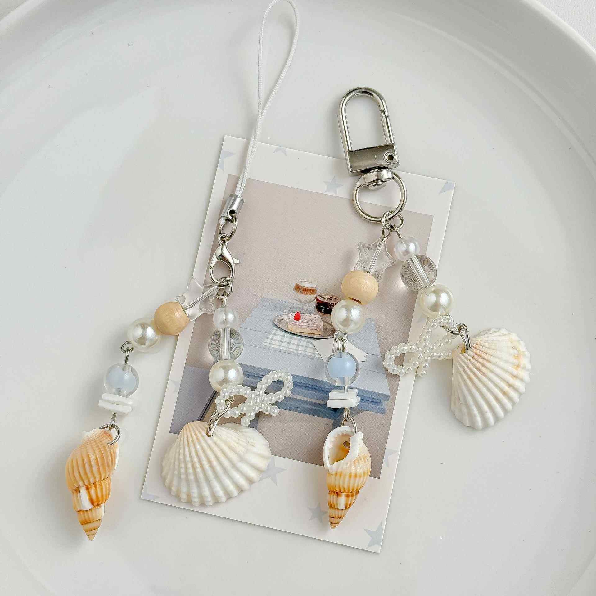 特别好看的手机链女2025年新款海洋珍珠贝壳风挂件ins风串珠咕本拍立得包挂零钱包钥匙扣,3C数码配件,手机挂件/手机链,淘宝优惠券,粉丝福利购,淘宝优惠卷
