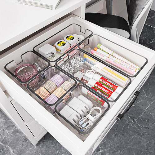 Drawer organizer with compartments, made of clear acrylic. I