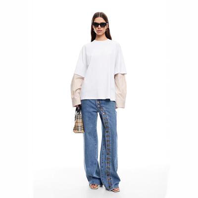 Multiple women's jeans with multiple buttons