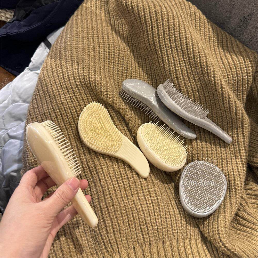 高级感别致按摩梳子~仿大理石塑料手持梳顺发软齿不打结椭圆发梳