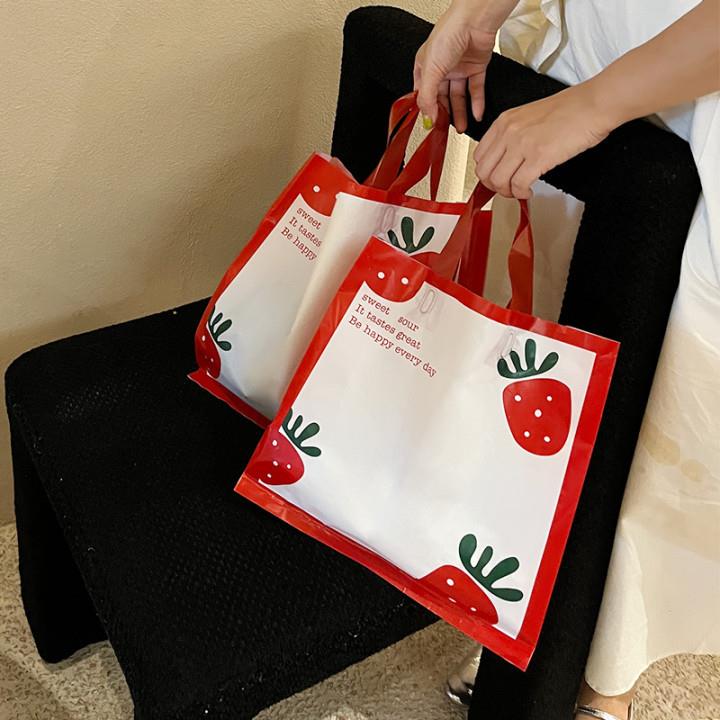新款直销草莓服装袋童装女装手提袋可印logo可爱包装购物礼品袋子
