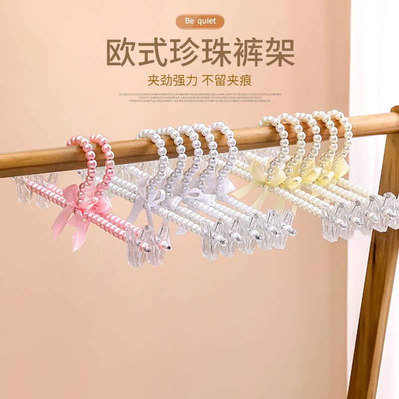 欧式珍珠衣架蝴蝶结儿童衣架珍珠裤夹宠物衣架挂衣服撑子仙女衣挂图片