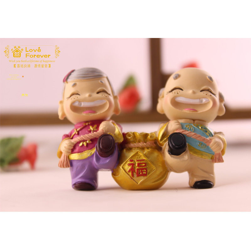 大禹家喜树脂工艺品公婆情侣背金袋家居饰品创意摆件汽车树脂摆件