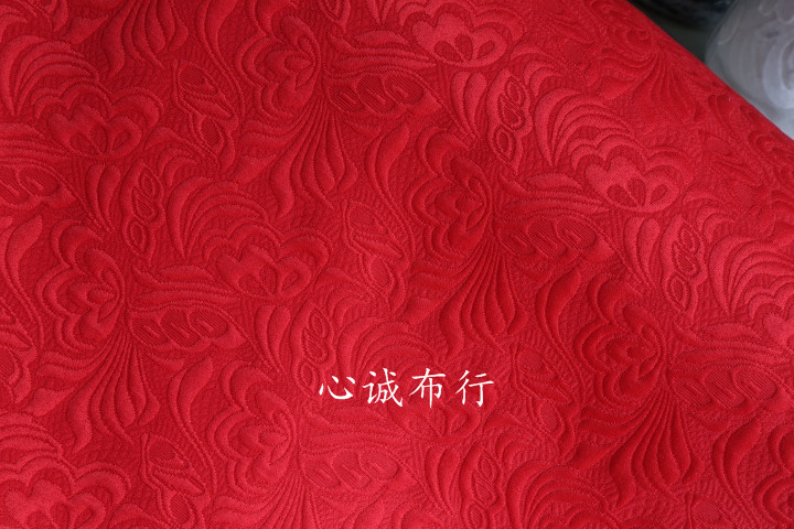 新品骨架感 大红色浮雕感凸感蝴蝶花提花面料 风衣外套连衣裙面料
