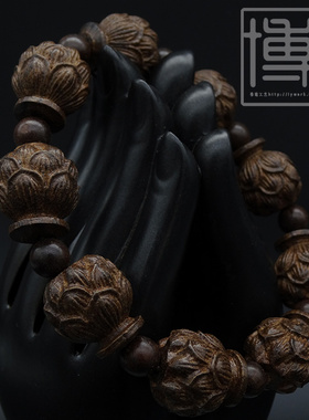 沉香木皮灰木黑檀雕莲