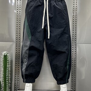 Home Daily 夏日清爽穿搭!夏季百搭拼色速干阔腿休闲束脚裤子男