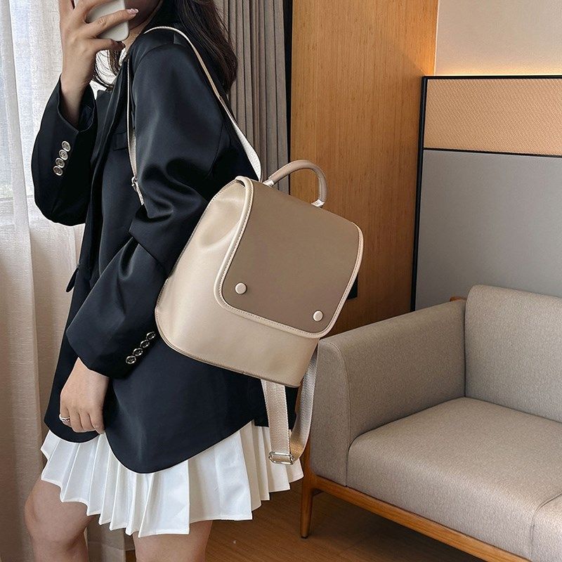 极简百搭双肩包简约女大学生小巧学院风撞色背包韩系包盖式软皮包
