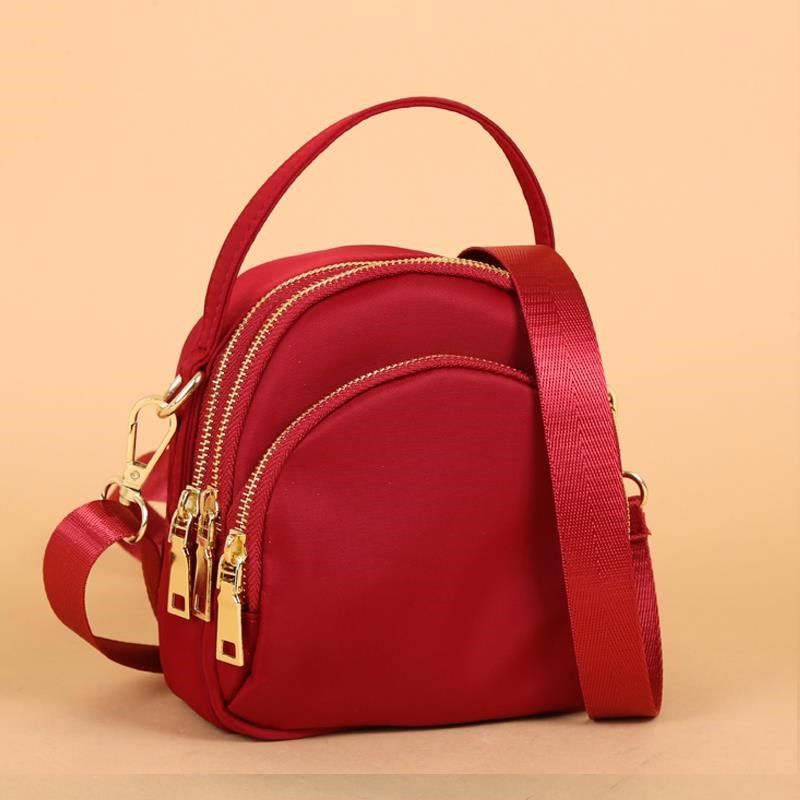 女2024新款轻斜挎包女帆布简约迷你手提中年妈妈小包女牛津布女包