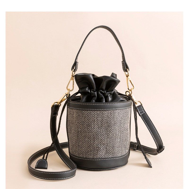 高级感抽绳撞色水桶包新潮小众设计帆布单肩包时尚手提斜挎圆筒包,箱包皮具/热销女包/男包,手拿包,淘宝优惠券,粉丝福利购,淘宝优惠卷