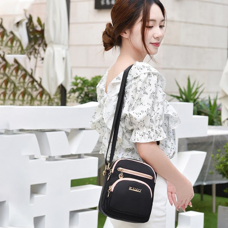 帆布包女百搭韩系休闲斜挎包轻便多口袋女士包牛津布包超火小包包