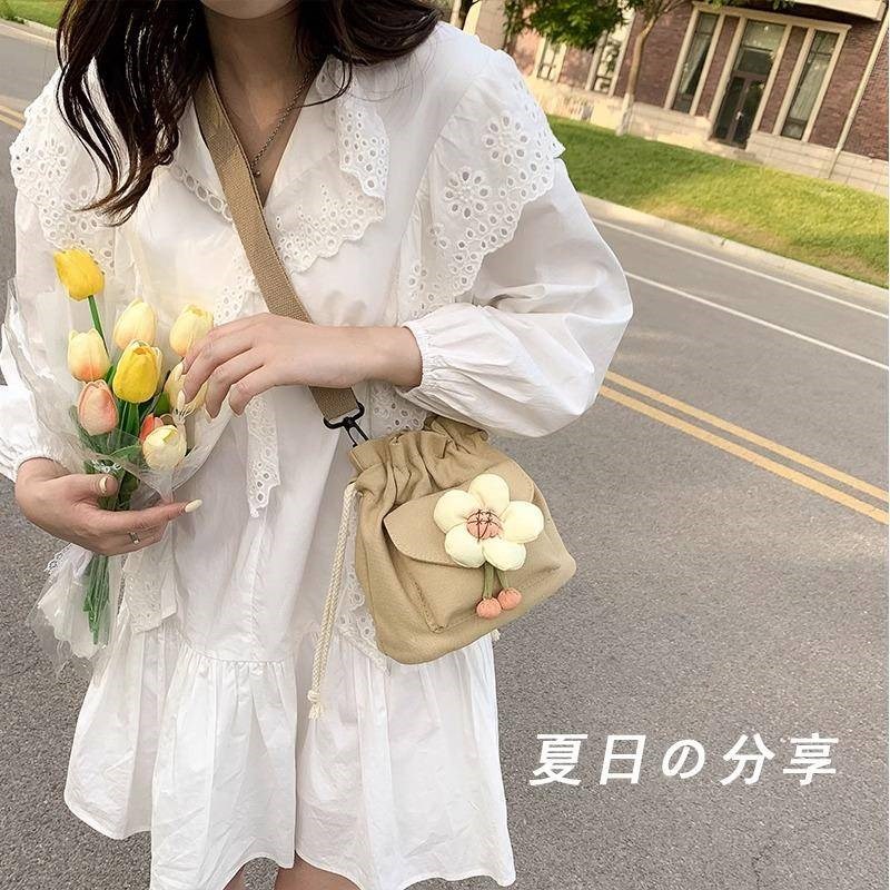 斜挎包新款水桶包女可爱单肩包文艺小清新休闲帆布包秋冬季手工