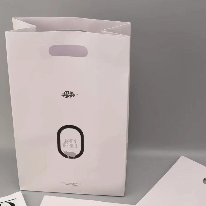 手提纸袋定制印刷logo定做服装店广告公司企业礼品袋镂空挖孔手提